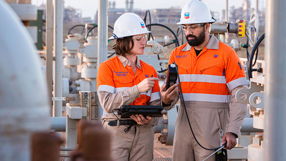 Two Chevron employees having a discussion