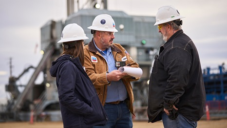 Workers in front of rig at Rockies Business Unit in Greeley, CO.