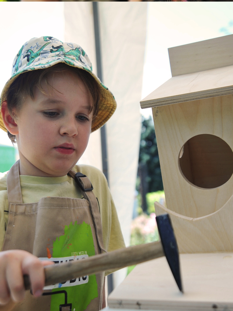 A boy doing crafts at a recent fashion event in Kazakhstan.