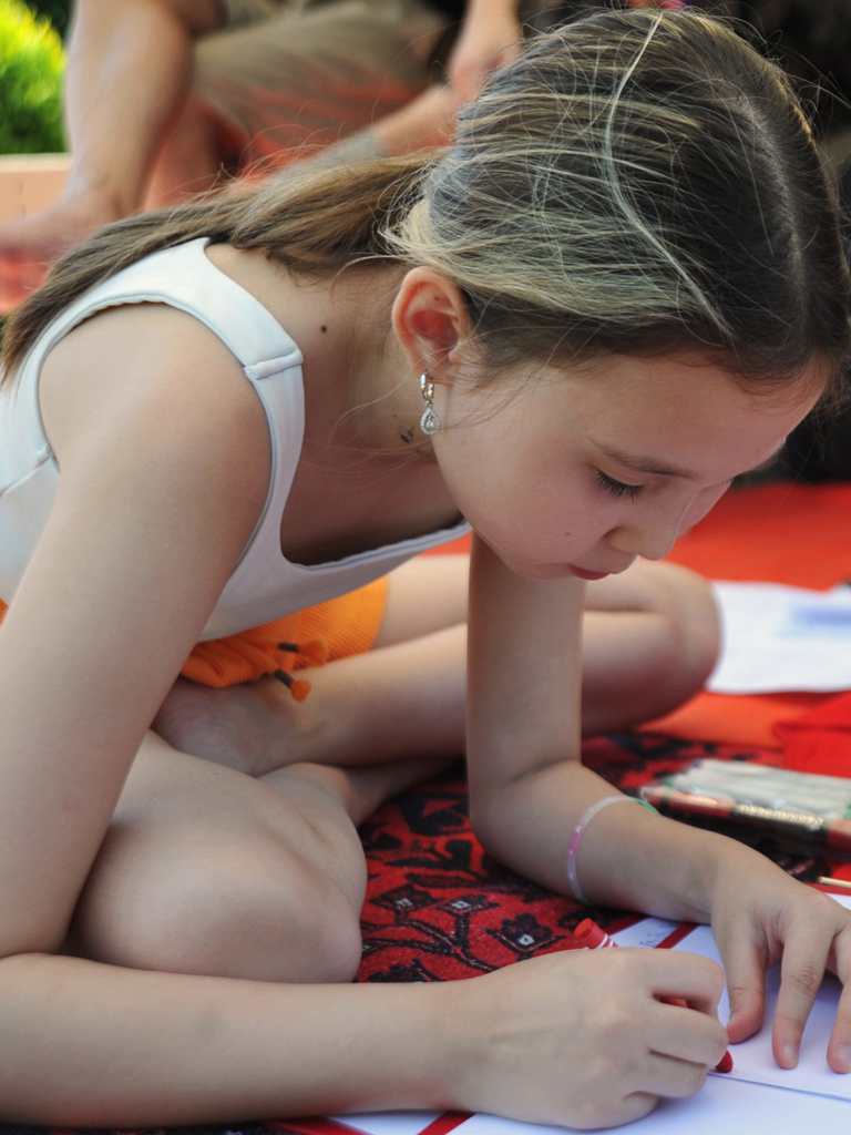 A girl doing crafts at a recent fashion event in Kazakhstan.