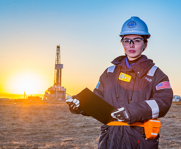 Worker smiling, Tengizchevroil has invested more than $28 billion in Kazakhstani goods and services