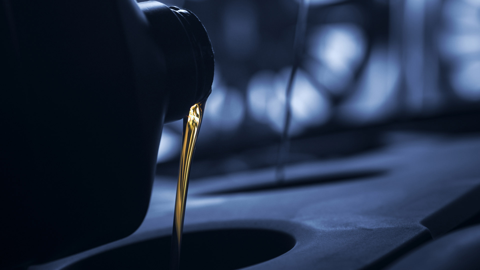 oil being poured into a container